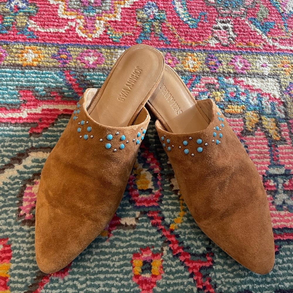 Johnny was tan leather studded mules.